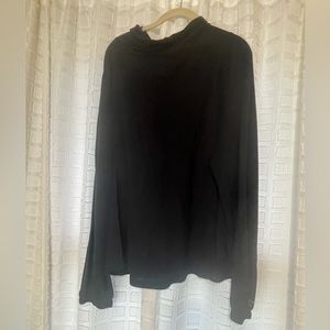 Pullover top with cowl drawstring neck.